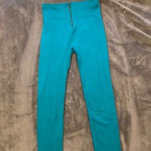 Blue leggings with a zipper in the front; warm